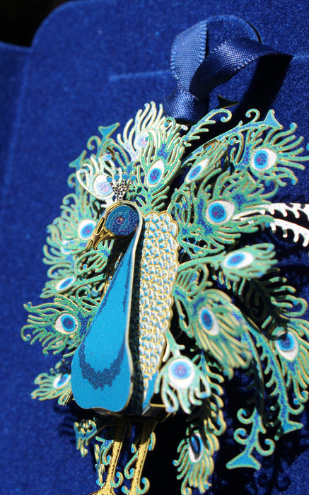 Side view of peacock ornament showing 3D effect