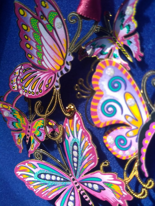 Closeup of the butterflies showing layered metal