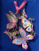 Butterfly Collage brass ornament with five colorful butterflies