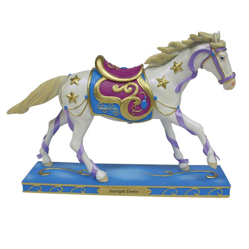 Trail of Painted Ponies figurine of a pale horse with light gold mane and tail. Cantering with purple silk, gold stars and an ornate carousel-esque saddle in maroon. On a blue base with swirl accents and the nameplate of "Starlight Dance"