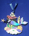 Mermaid ornament shown on a blue backdrop
