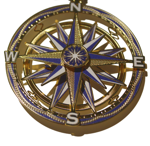 Compass brass ornament with N, E, S, W and nautical star in blue, white and gold