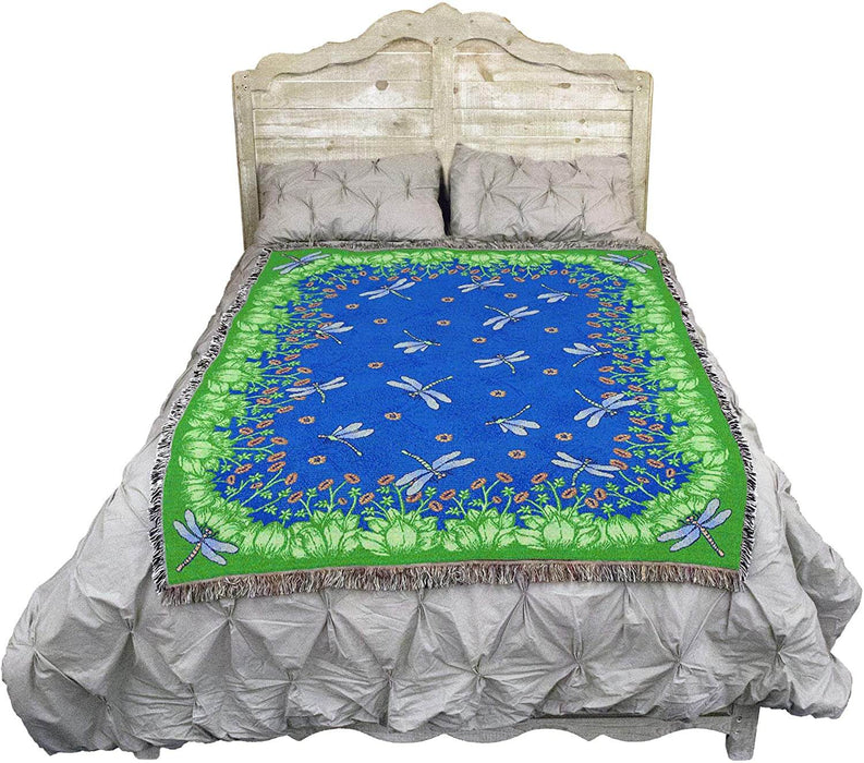 Dragonfly pond tapestry blanket shown on a bed
