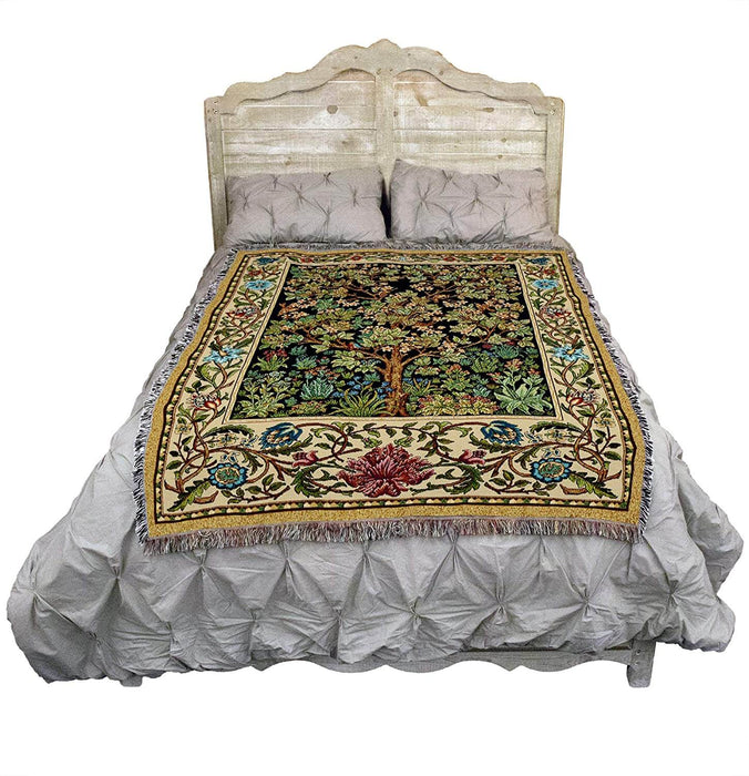 Tree of Life with floral border tapestry blanket show on a bed