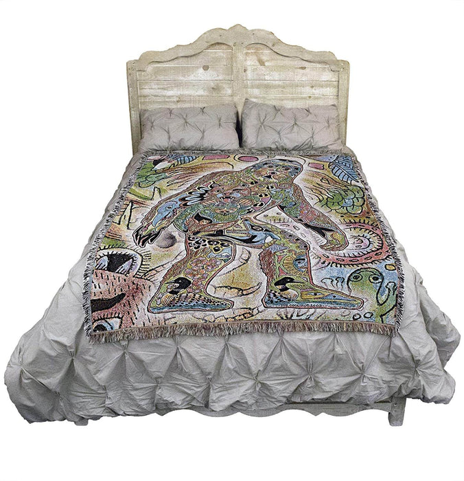 Bigfoot Sasquatch blanket shown on a bed