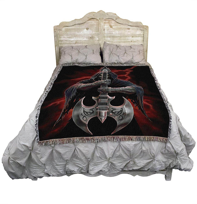 Skeleton guitar axe tapestry blanket shown on a bed