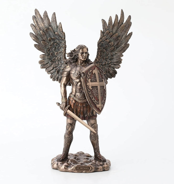 Saint Michael the archangel clad in battle armor with sword and shield and feathered wings