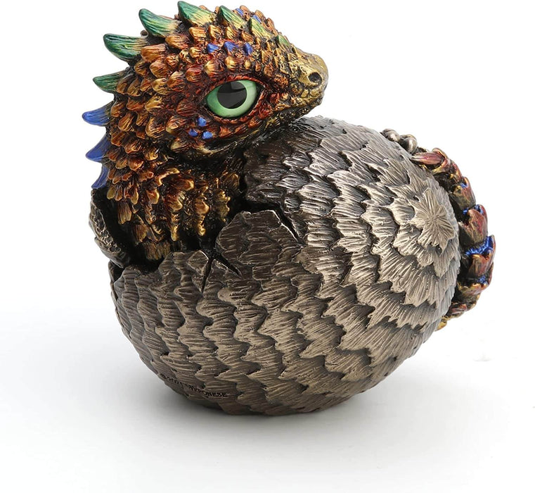 Baby dragon hatching from egg, done in shades of gold and red with blue and yellow accents and a green eye. Egg is bronze-tan