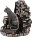 A cat wearing a pentacle sits upon a stack of thick leather-bound books. Next to the feline is a broom and bubbling cauldron, spiderweb, chalice, and athame dagger with a rose. A brick backdrop completes the piece. View from the right showing the textured fur of the cat