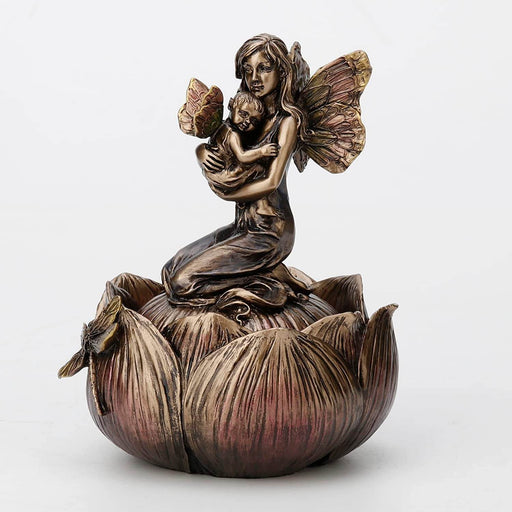 Trinket box in faux metal featuring a mother and baby fairy on a flower with a dragonfly