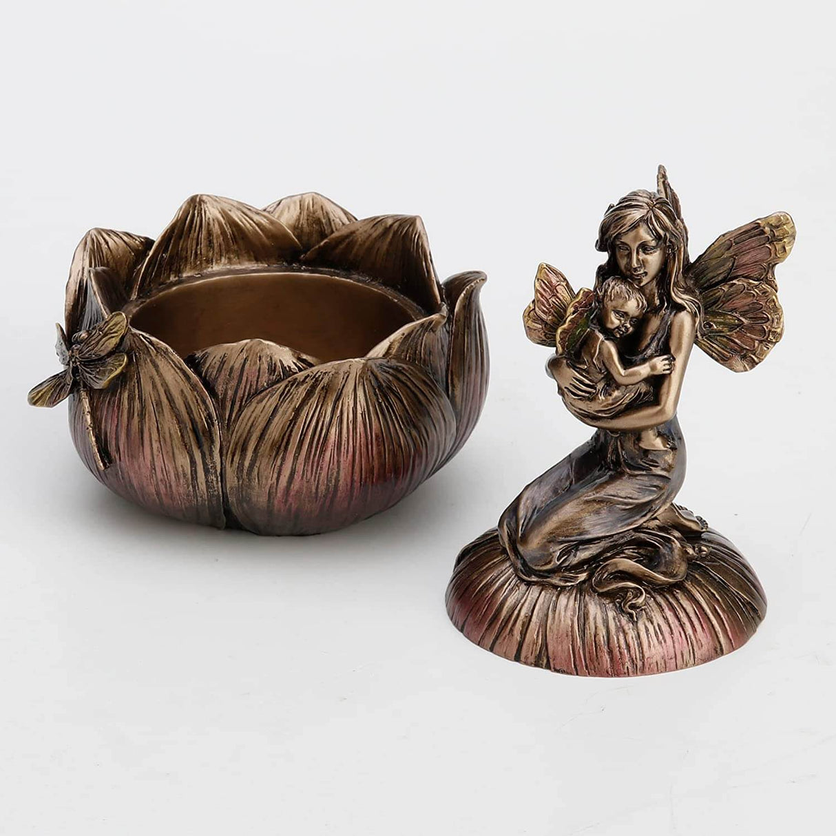 Trinket box in faux metal featuring a mother and baby fairy on a flower with a dragonfly. Shown with lid off