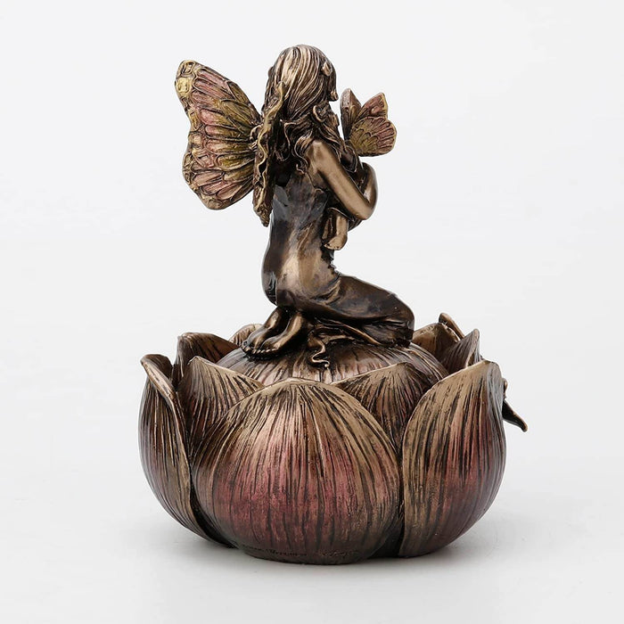 Trinket box in faux metal featuring a mother and baby fairy on a flower with a dragonfly. Shown from the back