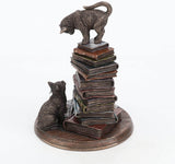 Moral High Ground figurine viewed from the side showing books and cats