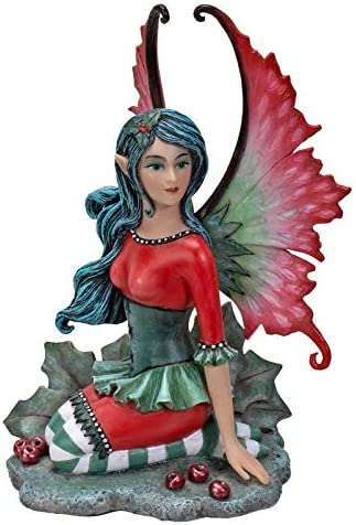 Fairy Figurine in red and green with holly leaves and berries, by artist Amy Brown.