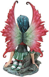 Fairy Figurine in red and green with holly leaves and berries, by artist Amy Brown. Back view showing crimson and emerald wings