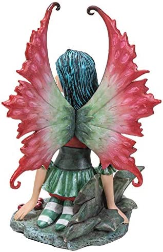 Fairy Figurine in red and green with holly leaves and berries, by artist Amy Brown. Back view showing crimson and emerald wings
