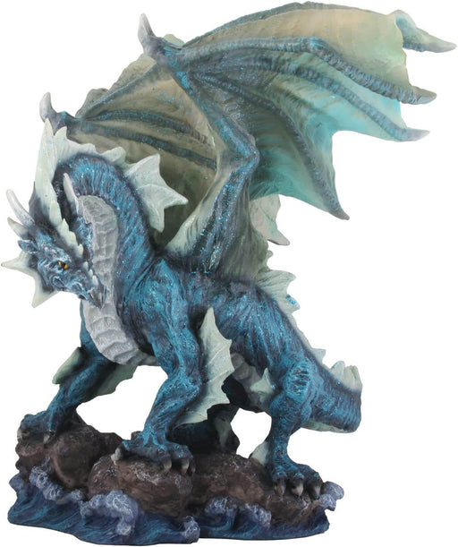 Blue dragon figurine standing on rocks above a stormy sea