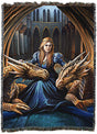 Tapestry blanket by artist Anne Stokes with a princess in blue flanked by two golden dragons