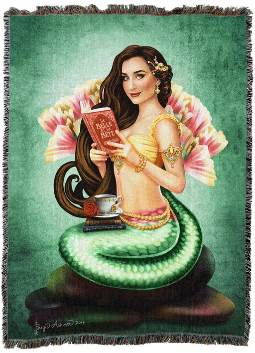 Tapestry blanket with art by Brigid Ashwood showing a green-tailed mermaid with golden top and brunette hair. She holds a book, with more on her lap and a cup of tea with a rose perched on top. Green background.