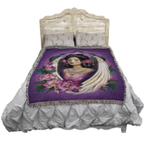 Lotus Angel tapestry blanket by Brigid Ashwood shown displayed on a bed with a wooden headboard