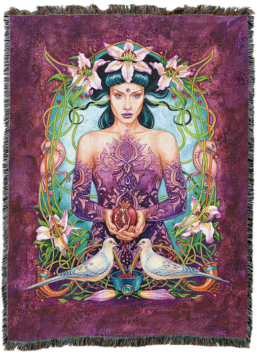 Tapestry blanket showing a woman holding a pomegranate with two white doves. The lady has black hair and purple plant tattoos, and is framed by lilies with a purple-red border