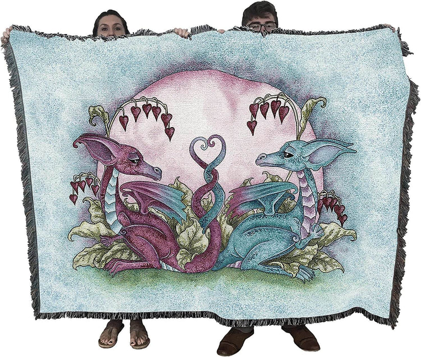 Two adults holding up the dragon tapestry blanket