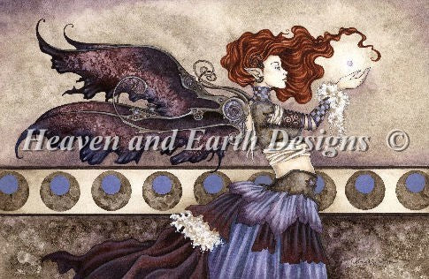 image of A Singular Wish cross stitch pattern by Amy Brown, featuring a red headed fairy gazing at a glowing orb, clad in elaborate skirts