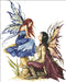 Always Fairies by Amy Brown. Finished cross stitch. Design is two fairies gazing into each other's eyes. Fairy lady wears a blue dress and has red-brown hair and blue and yellow wings. She sits on a mushroom. Kneeling in front of her is a black haired fairy prince with a maroon cape.