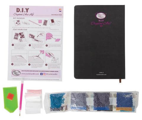 Crystal art journal kit contents showing instructions, journal, jewels and tools