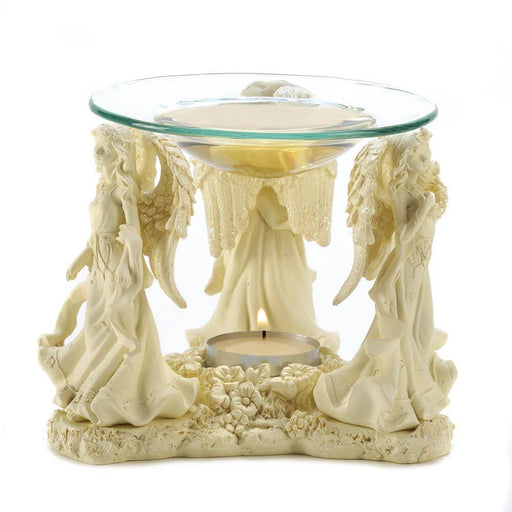 Trio of angels with glittering wings hold up a glass bowl to melt a scented wax cube or oil. A place underneath, decorated with flowers, holds a tea light candle.