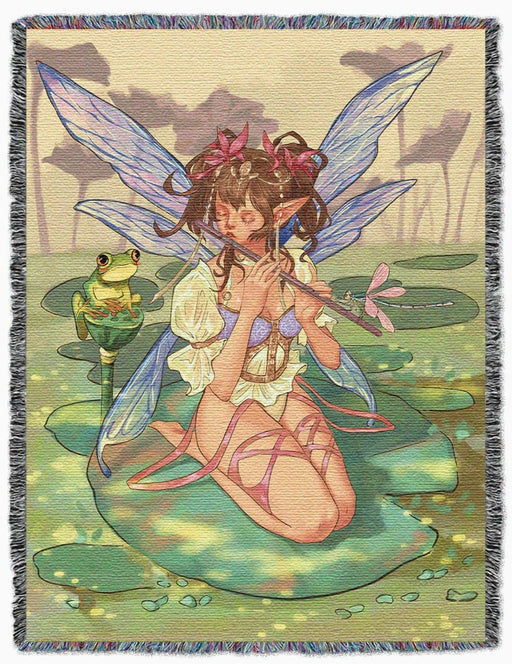 Fairy playing the flute to a dragonfly and a frog, sitting on a lily pad in a pond - tapestry blanket