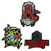 Set of three lapel pins themed for Dungeons & Dragons. One has the D&D logo in a spooky doorway. One has a clawed green hand holding out dice with magic lightning flickers. The last has a D20 dice in black with the text "Adventure Awaits"