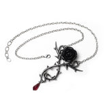 Necklace with black pewter rose, thorn vines, and red crystal drop on a trace chain