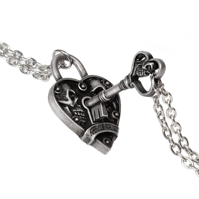 Key pendant fitting into heart lock pendant
