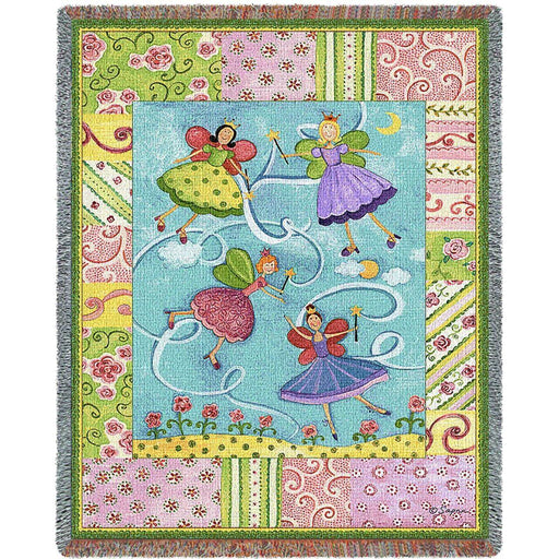 Tapestry blanket with a pink and spring green border of floral patterns. In the center is an image of four fairy princesses waving their magic wands through the air