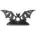 Black bat tealight holder with wings outstretched, and moon phases cut out to show the candlelight.