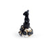 Miniature figurine of a black cat perched on a human skull decorated with black roses and gold leaves. Shown from the side/back