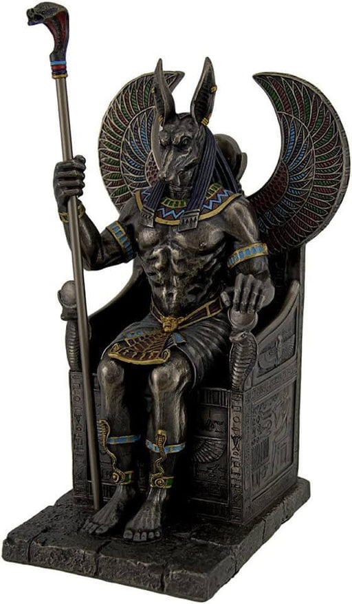 Egyptian Jackal-headed god Anubis sitting in a throne with a snake-headed scepter 