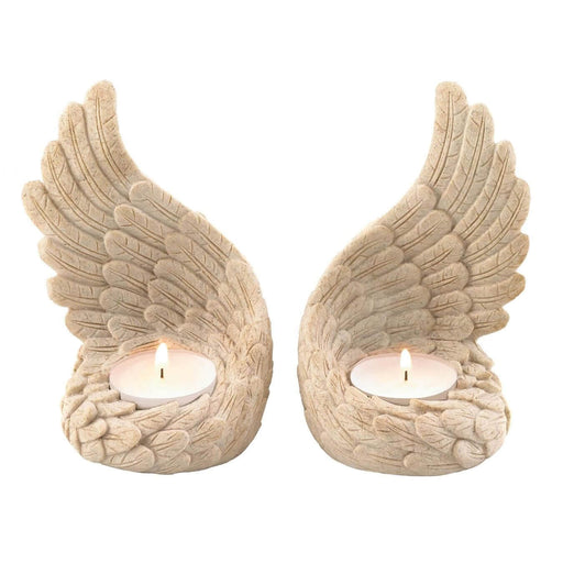 Angel wing tealight holder set with lit candles