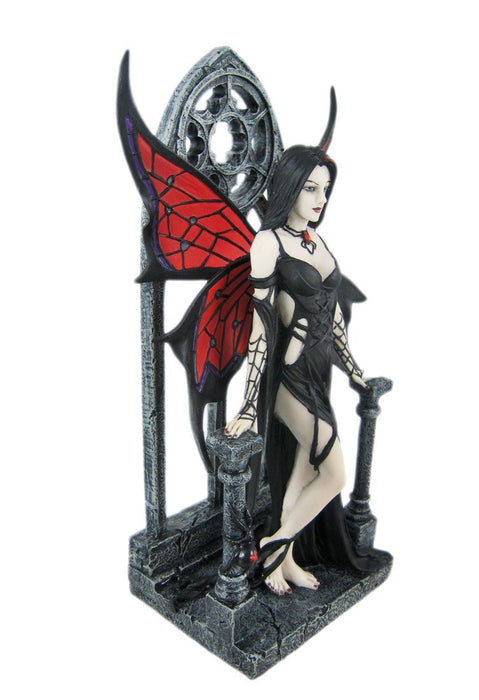Spider themed fairy in red and black with Gothic archway, shown from the side