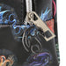Closeup of zipper pull on makeup bag - shining metal dragon attached to zipper
