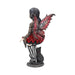 Pixie figurine wearing black and maroon holding a pumpkin. A black cat sits next to the fairy.. Side/ back view