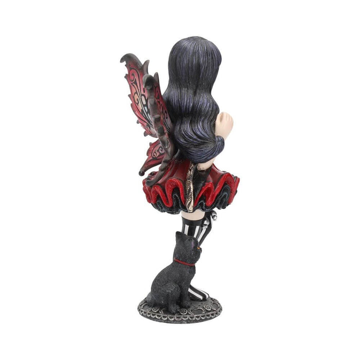 Side/back view of Pixie figurine wearing black and maroon holding a pumpkin. A black cat sits next to the fairy.