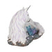 White unicorn with jewels in mane and tail laying down near blue-purple crystals. Showing mane studded with gems