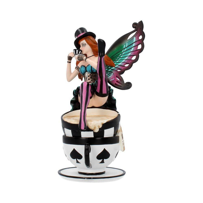 Mad Hatter fairy sitting on two teacups and drinking a smaller cup of tea. Done in a teal, pink and black color scheme, with red hair. Front view showing tea spilling out of the cup slightly