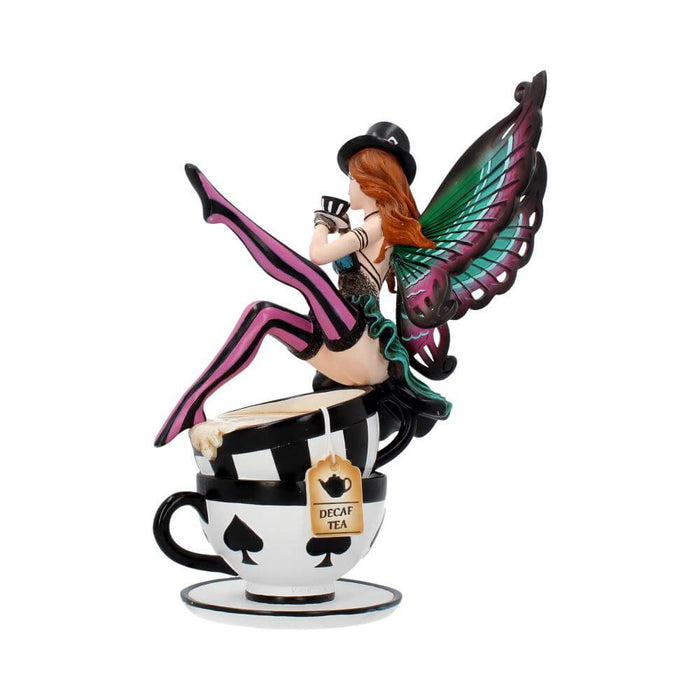 Mad Hatter fairy sitting on two teacups and drinking a smaller cup of tea. Done in a teal, pink and black color scheme, with red hair. Side view showing tea tag reading "Decaf Tea"
