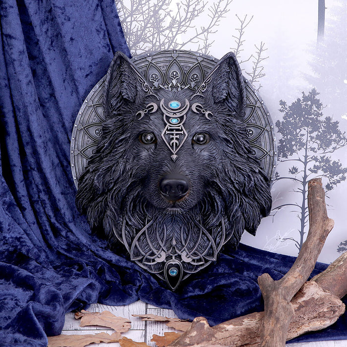 Black Wolf Moon Plaque shown with a velvet backdrop and accessories.