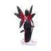 Queen of Hearts figurine - fairy with red and black dress, white and black stockings, red, purple and black wings standing on playing cards. Back view
