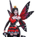 Queen of Hearts figurine - fairy with red and black dress, white and black stockings, red, purple and black wings standing on playing cards. Closeup. She wears a choker and a gold crown