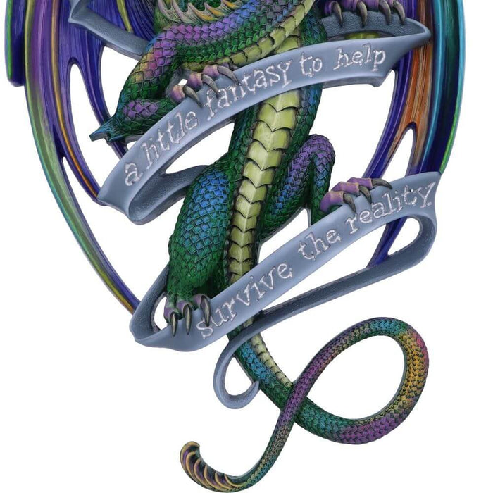 Wall plaque rainbow dragon with words "Sometimes we all need a little fantasy to help survive the reality." Closup of bottom - colorful legs and tail and the blue ribbon